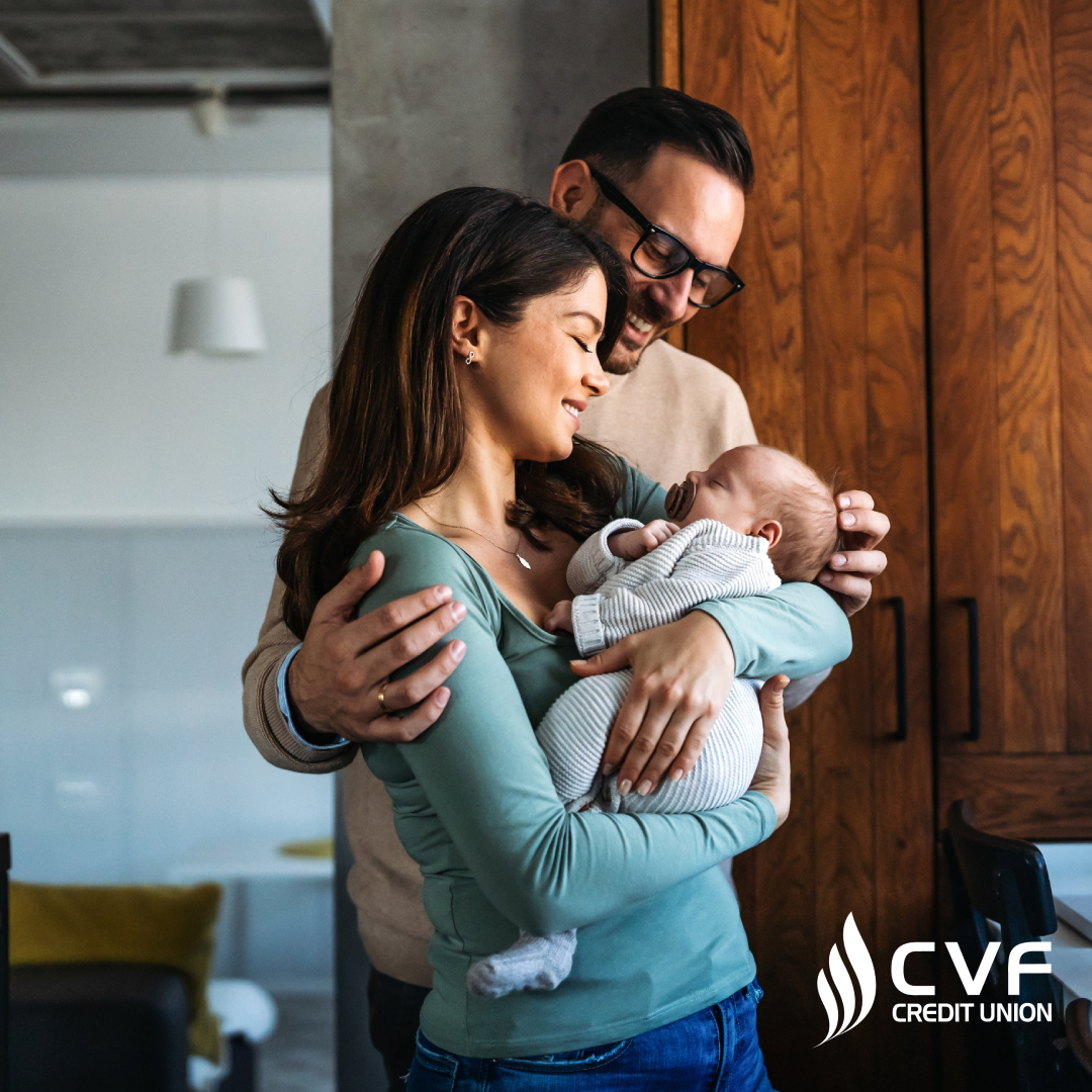 couple holding baby