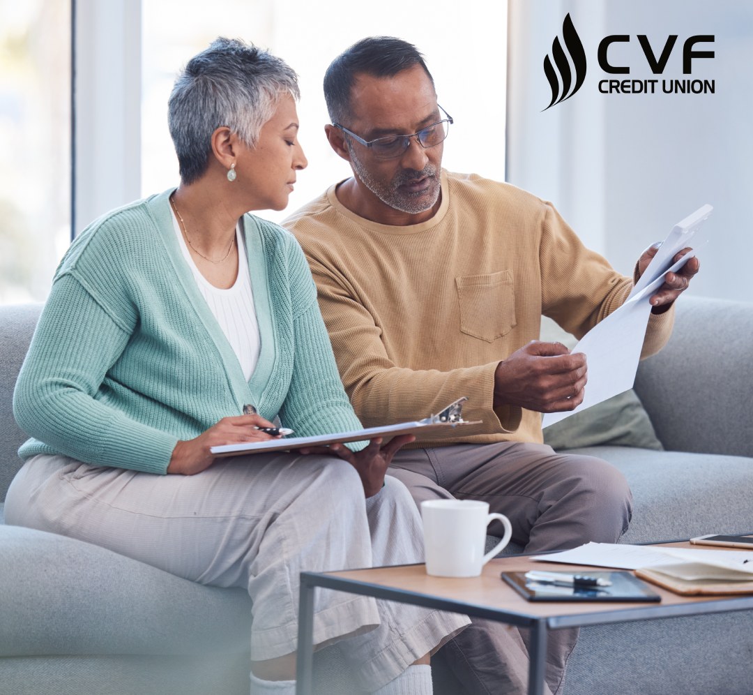 Older couple reviewing financial docs