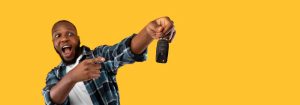 A gentleman holding a car key