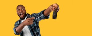 A gentleman holding a car key