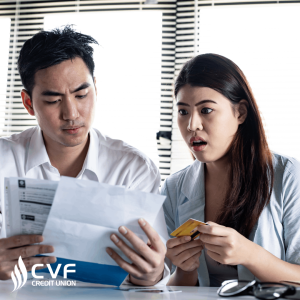 Couple looking at debit, bills