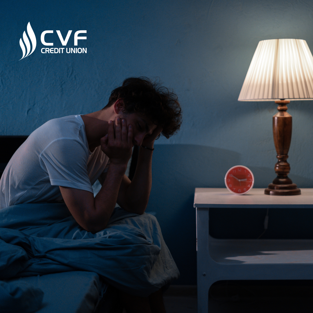 Guy on edge of bed, worrying